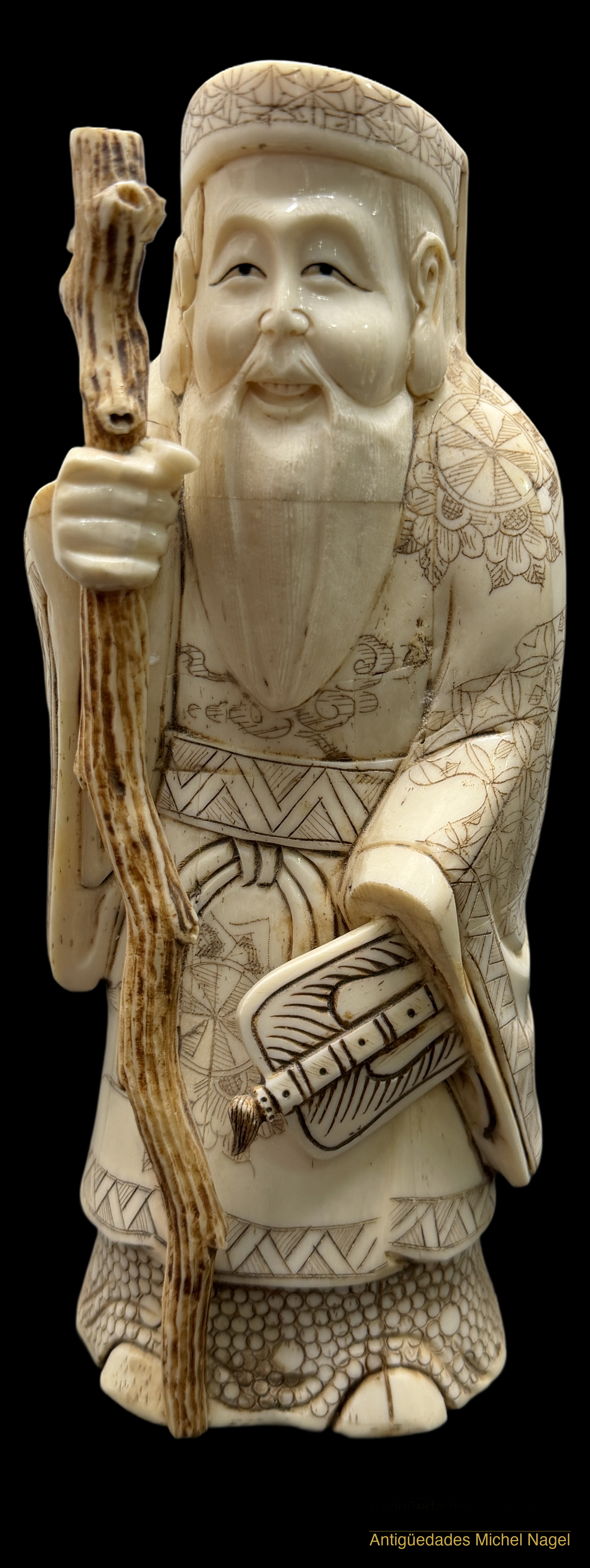 Figura de marfil tallado representando deidad de la longevidad